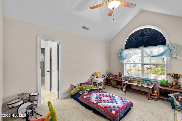 recreation room with visible vents, a ceiling fan, baseboards, light colored carpet, and vaulted ceiling