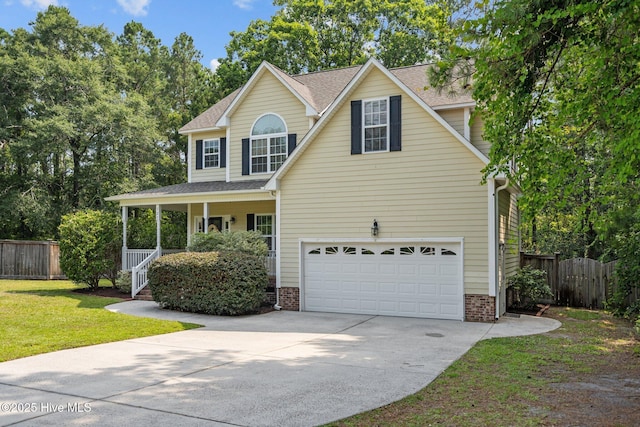 traditional-style home featuring a front lawn, a porch, fence, concrete driveway, and an attached garage