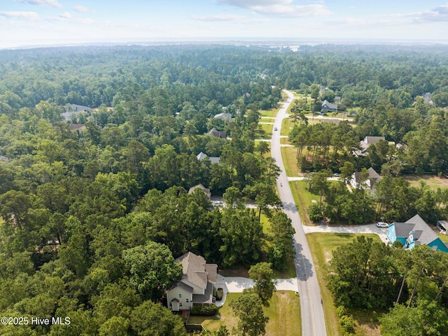 aerial view with a wooded view