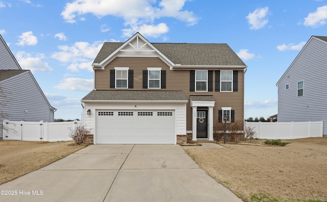 view of front of property featuring an attached garage, a shingled roof, fence, driveway, and a gate