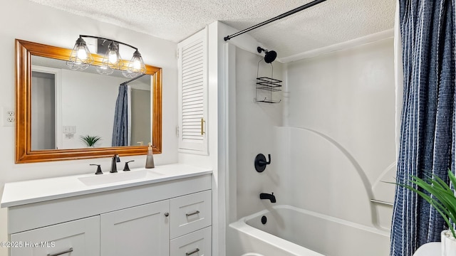 bathroom featuring vanity, a textured ceiling, and shower / tub combo