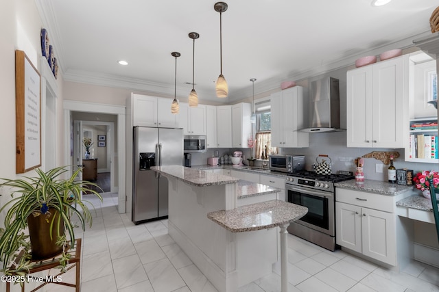 kitchen featuring backsplash, a kitchen island, crown molding, wall chimney range hood, and stainless steel appliances