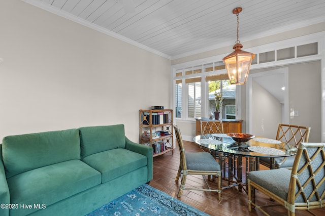 dining space with crown molding, baseboards, wooden ceiling, wood finished floors, and a notable chandelier