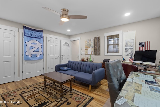 living room featuring light wood-style flooring, recessed lighting, and a ceiling fan