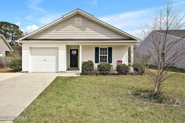 single story home featuring covered porch, an attached garage, concrete driveway, and a front yard