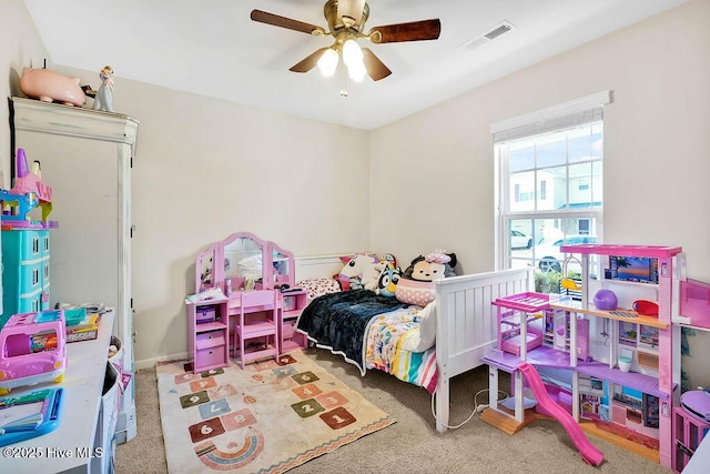 bedroom featuring visible vents, carpet floors, and ceiling fan