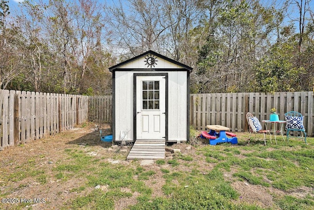 view of shed featuring a fenced backyard