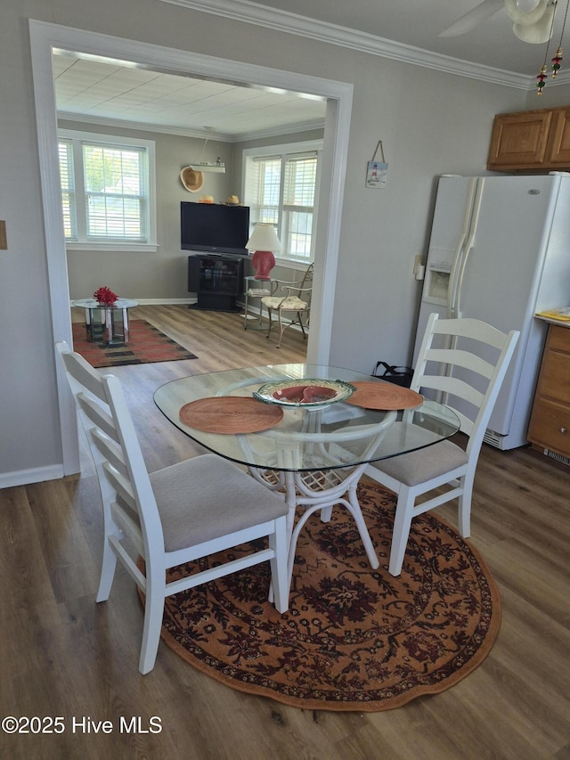 515 Mulberry St, Beaufort, NC 28516 - dining area featuring wood finished floors, ornamental molding, healthy amount of natural light, and baseboards