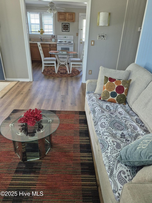 515 Mulberry St, Beaufort, NC 28516 - living area featuring wood finished floors, baseboards, stairs, and ceiling fan