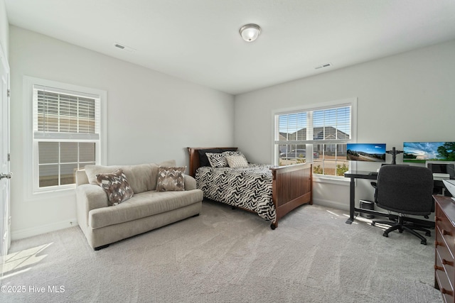 bedroom featuring visible vents, baseboards, and carpet floors