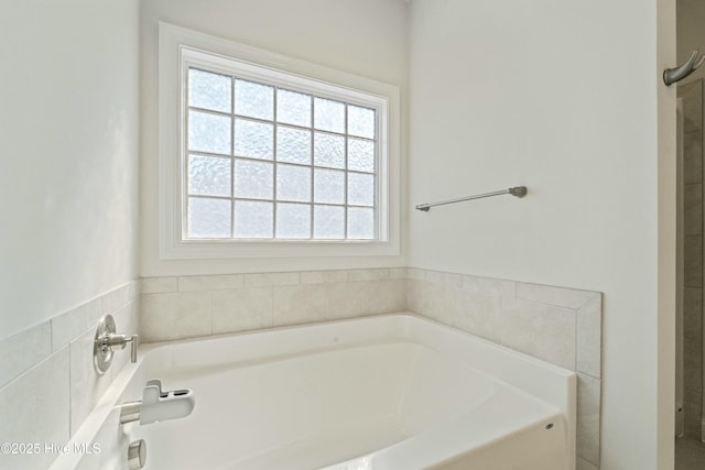 bathroom with a garden tub