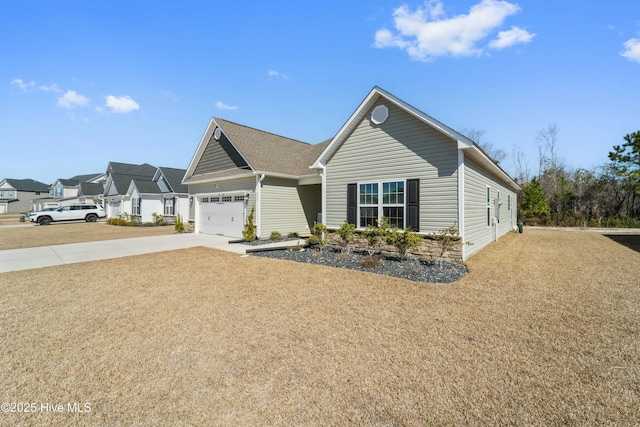 view of front of property with a garage and concrete driveway