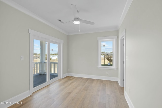 empty room with visible vents, baseboards, light wood-style floors, and a healthy amount of sunlight