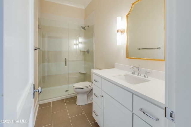 bathroom featuring vanity, tile patterned flooring, a stall shower, and toilet
