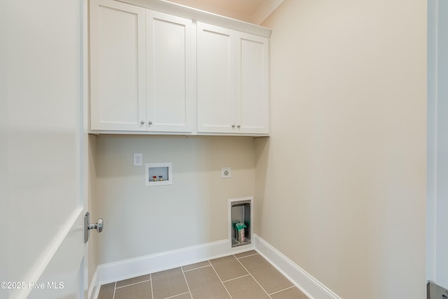 laundry room featuring tile patterned flooring, hookup for an electric dryer, hookup for a washing machine, baseboards, and cabinet space