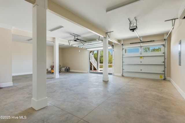 garage featuring baseboards and a garage door opener