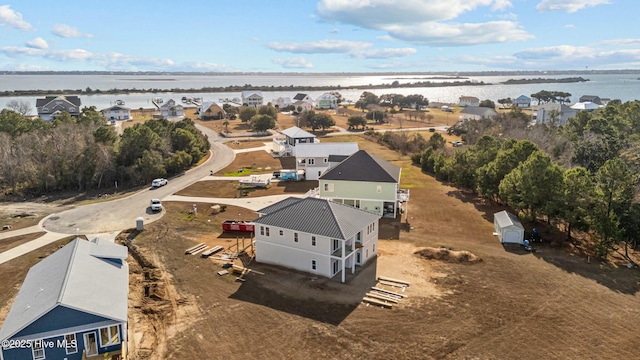 bird's eye view with a residential view and a water view