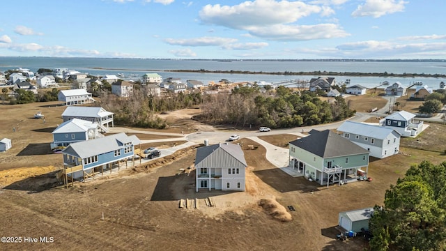 birds eye view of property featuring a residential view and a water view