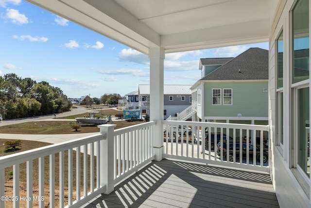 wooden deck featuring a residential view