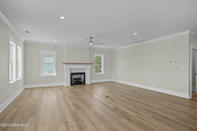 unfurnished living room with ornamental molding, baseboards, visible vents, and light wood-type flooring