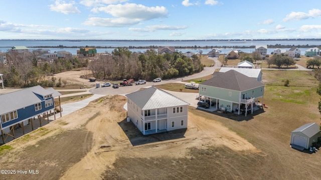 aerial view with a residential view and a water view