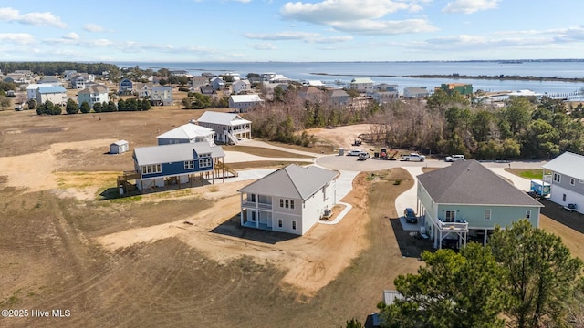 bird's eye view with a residential view and a water view