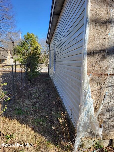 view of property exterior with fence