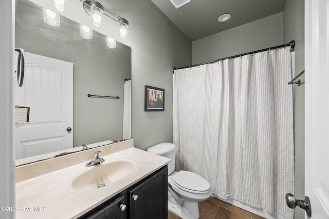 bathroom featuring tile patterned floors, visible vents, toilet, curtained shower, and vanity