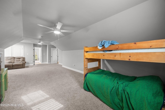 carpeted bedroom featuring ceiling fan, baseboards, and vaulted ceiling