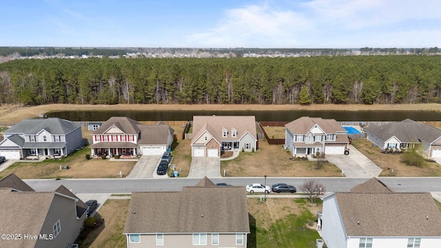 aerial view with a residential view and a wooded view