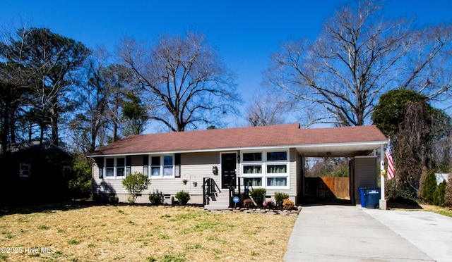 611 Jarman St, Jacksonville, NC 28540 - ranch-style home featuring a front yard, a carport, driveway, and crawl space