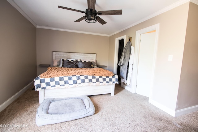 carpeted bedroom with ceiling fan, crown molding, and baseboards