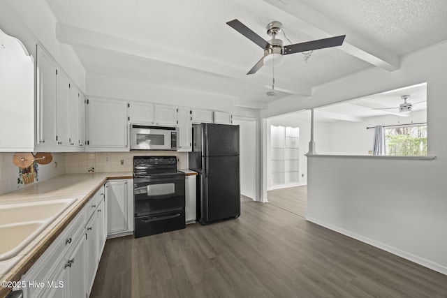 kitchen with beam ceiling, dark wood-style flooring, black appliances, white cabinetry, and backsplash