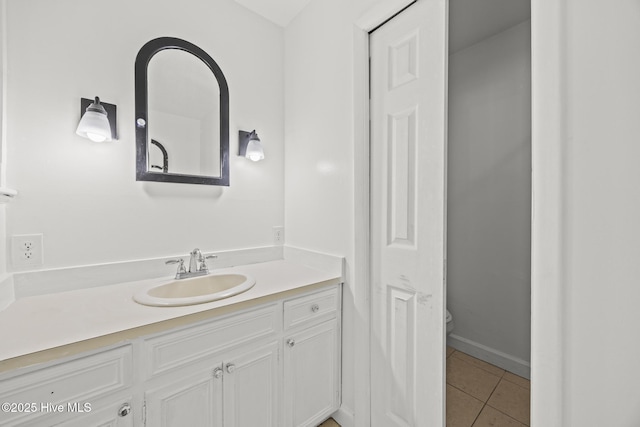 bathroom with tile patterned floors, toilet, and vanity