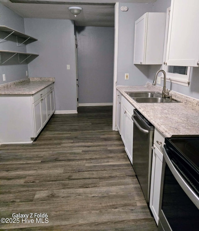 kitchen with white cabinets, dark wood-style floors, stainless steel dishwasher, a sink, and baseboards