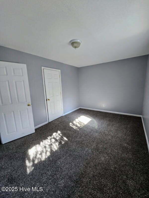 unfurnished bedroom with baseboards