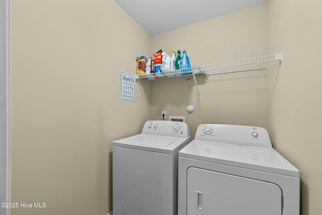 laundry area with separate washer and dryer and laundry area