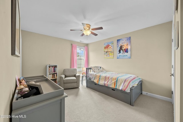 carpeted bedroom featuring a ceiling fan and baseboards