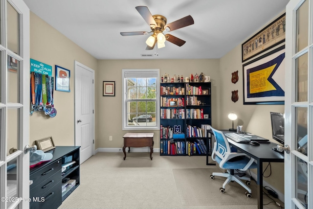 carpeted home office with french doors, baseboards, visible vents, and ceiling fan