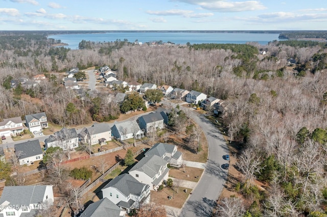 drone / aerial view with a residential view and a water view