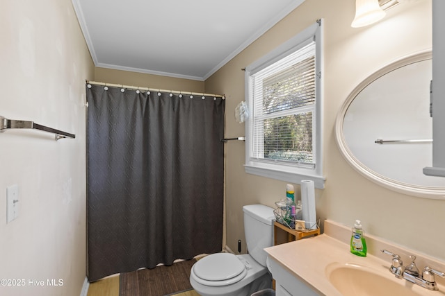 bathroom with curtained shower, vanity, crown molding, and toilet