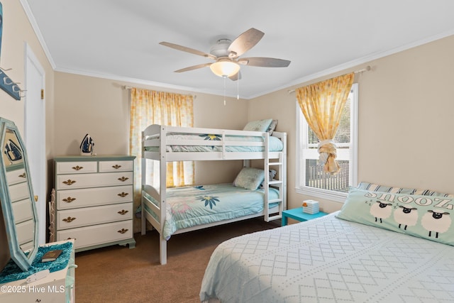 carpeted bedroom with crown molding and a ceiling fan