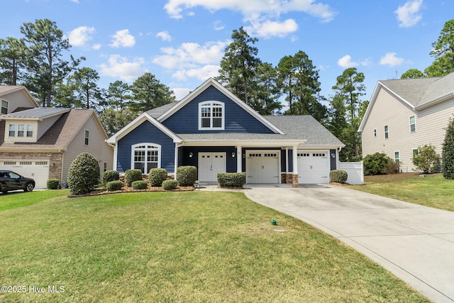 view of front of house with a front yard, an attached garage, driveway, and a shingled roof