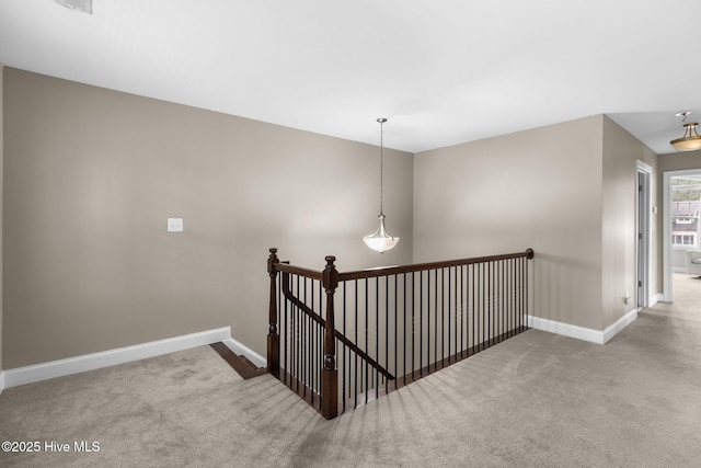 staircase with carpet and baseboards