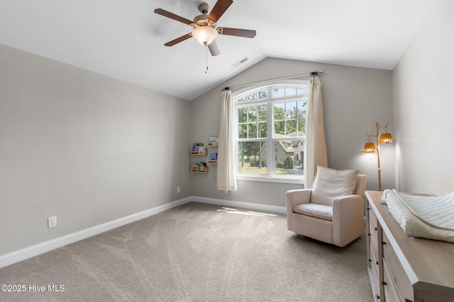 sitting room with visible vents, baseboards, vaulted ceiling, carpet floors, and a ceiling fan