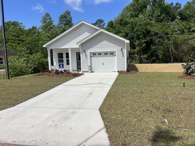 single story home with a porch, concrete driveway, an attached garage, and a front lawn