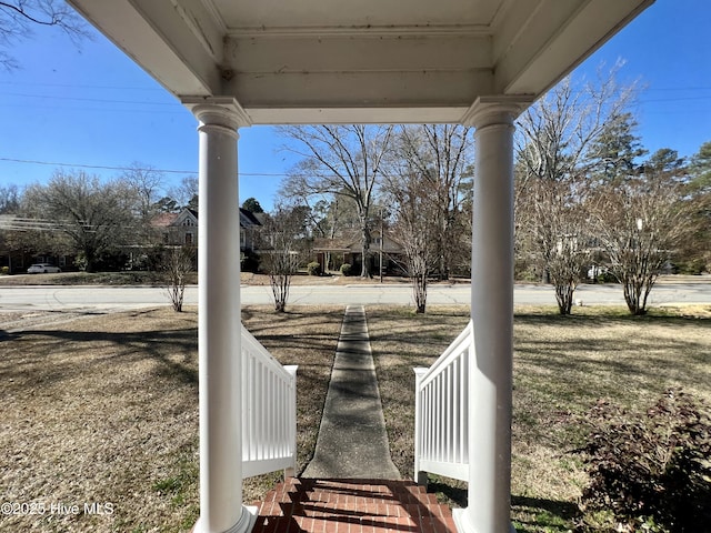 view of yard featuring covered porch