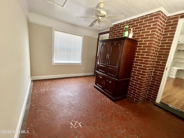 unfurnished bedroom featuring baseboards, ornamental molding, and a ceiling fan