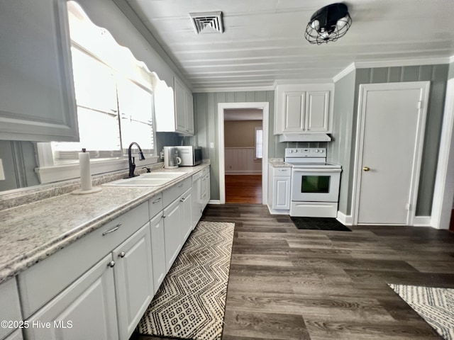 kitchen featuring visible vents, white range with electric cooktop, under cabinet range hood, a sink, and light countertops