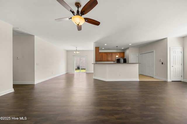 1012 Lake Norman Ln, Leland, NC 28451 - unfurnished living room featuring baseboards, a ceiling fan, dark wood-style floors, and recessed lighting